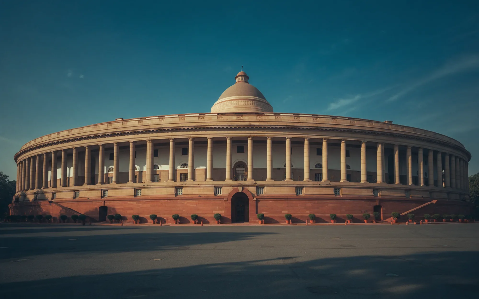 The Parliament of India building at blue hour
