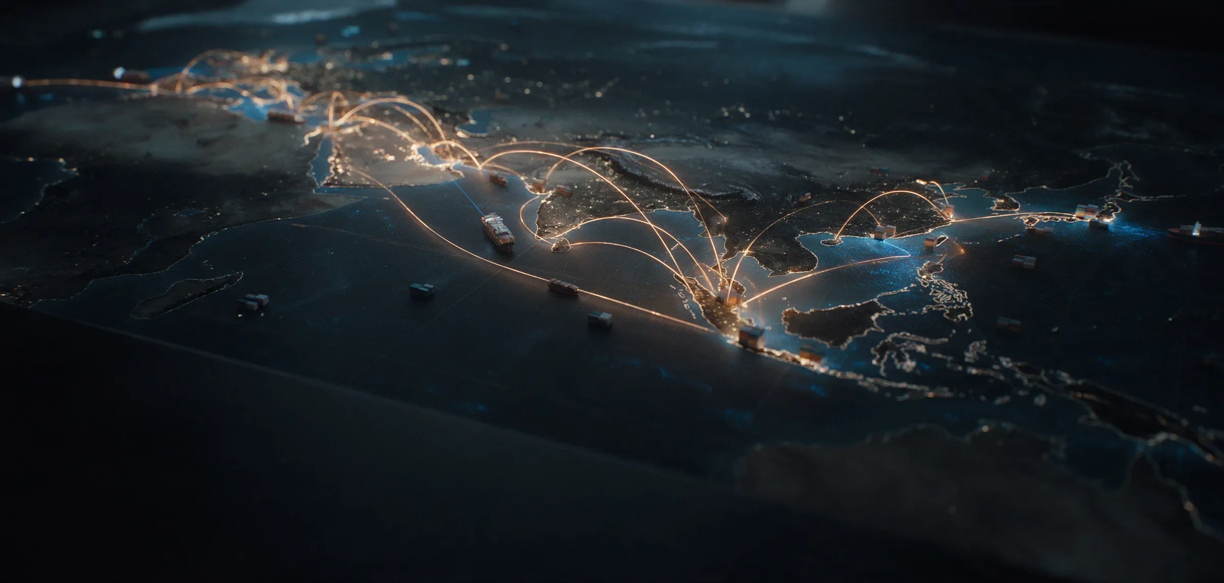 A map table with glowing supply-chain routes and model container ships